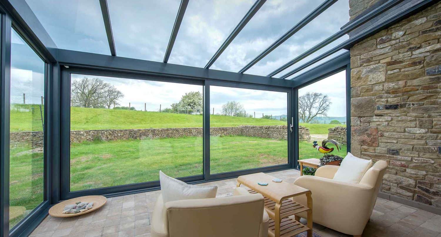 Aluminium lean to roof used to create a bright and airy conservatory in the country.