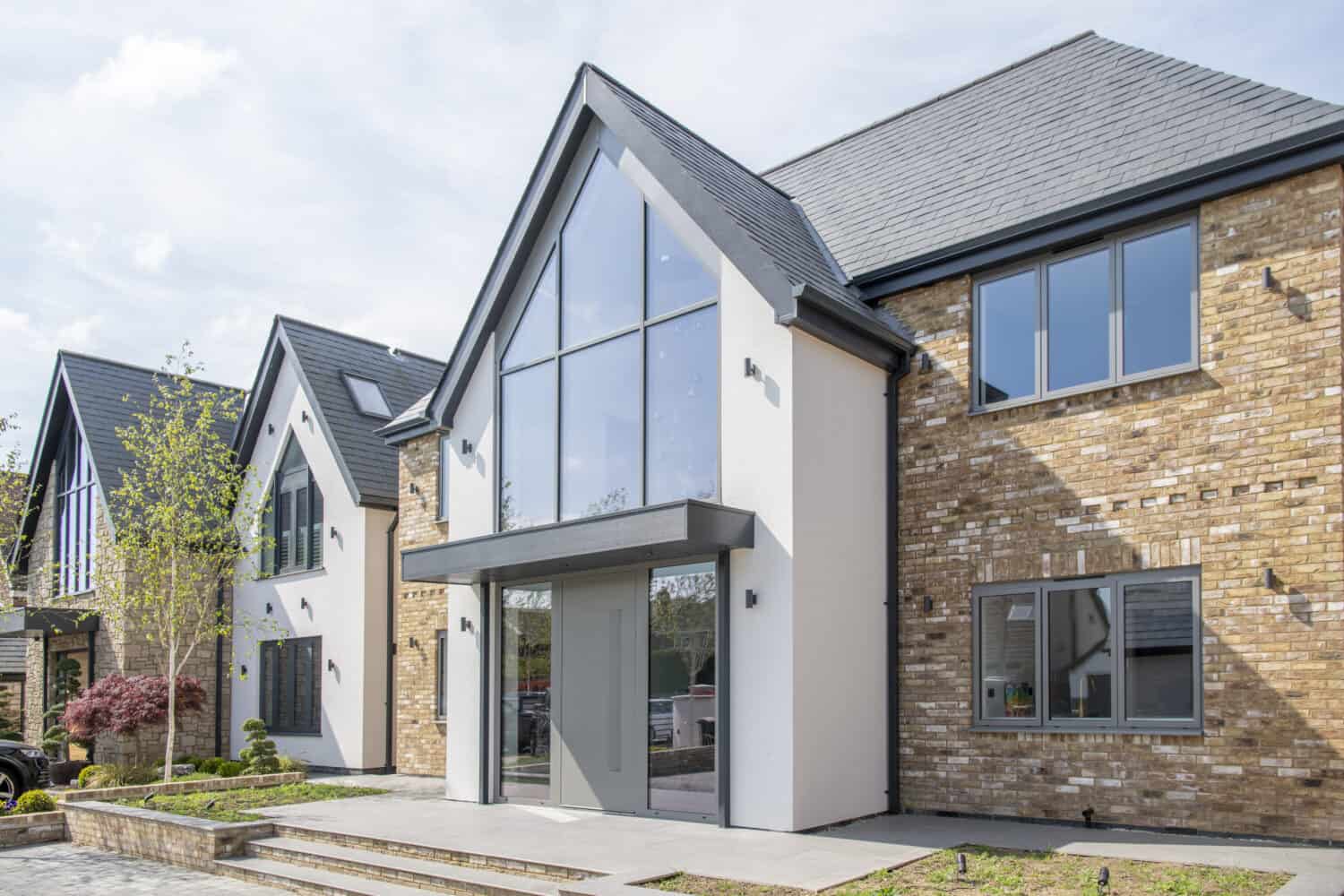New build houses featuring grey windows and front doors