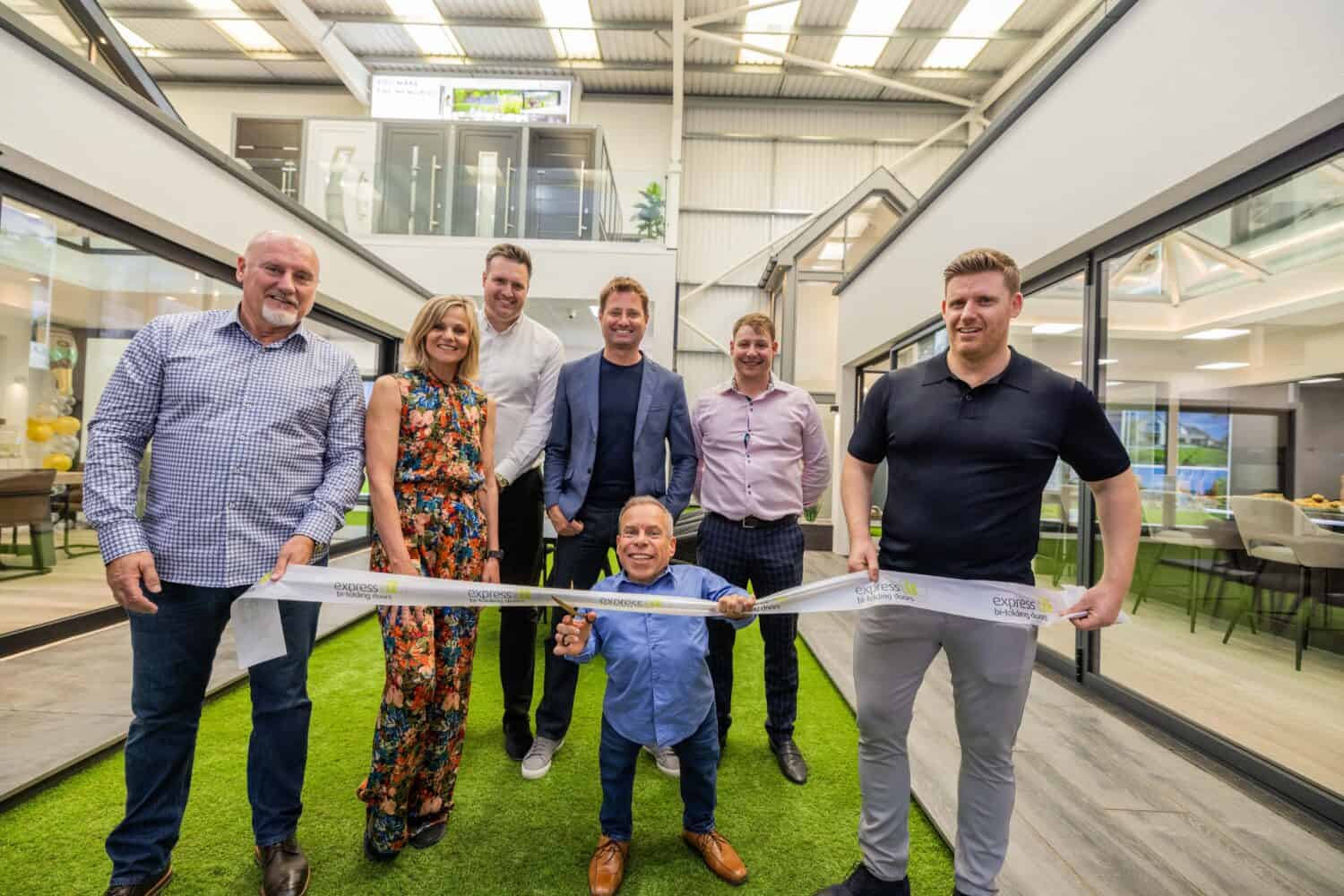 Warwick Davis and the team at Express Bi Folding Doors cutting the tape in their showroom