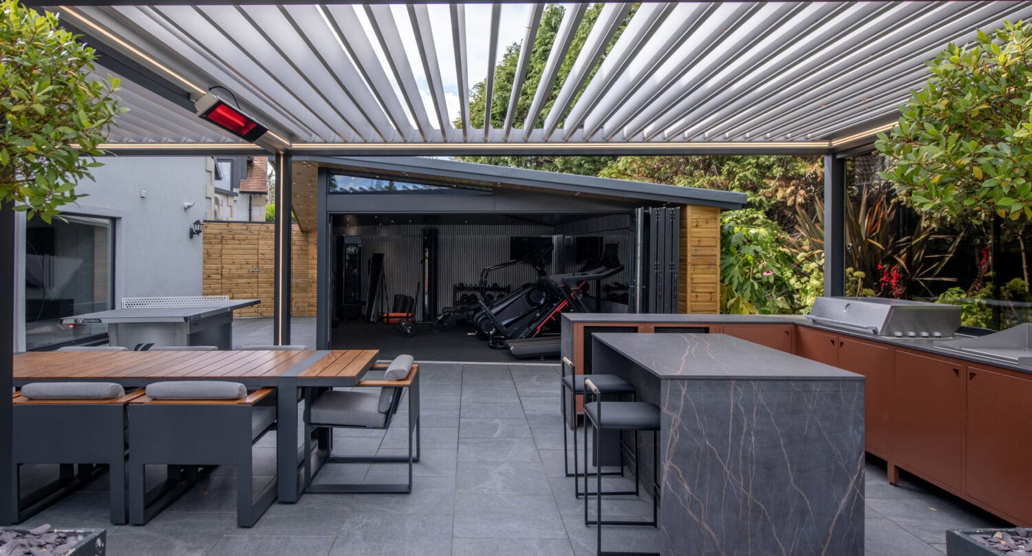 Elegant bi-folding doors opening to a stylish patio area, perfect for outdoor entertaining and seamless indoor-outdoor flow.