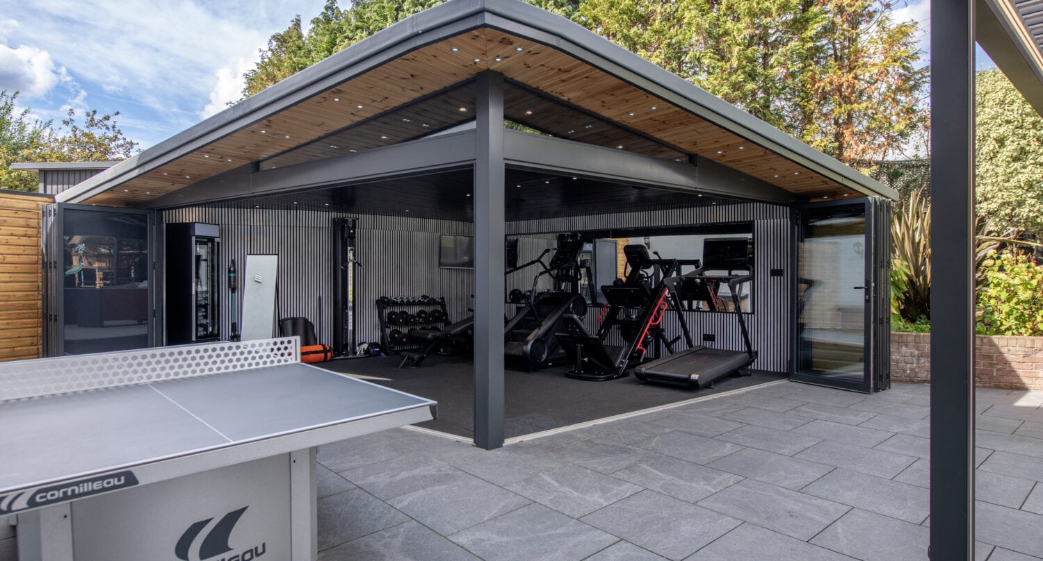 Bi-Folding doors opening to a stylish outdoor gym area in Harrogate.