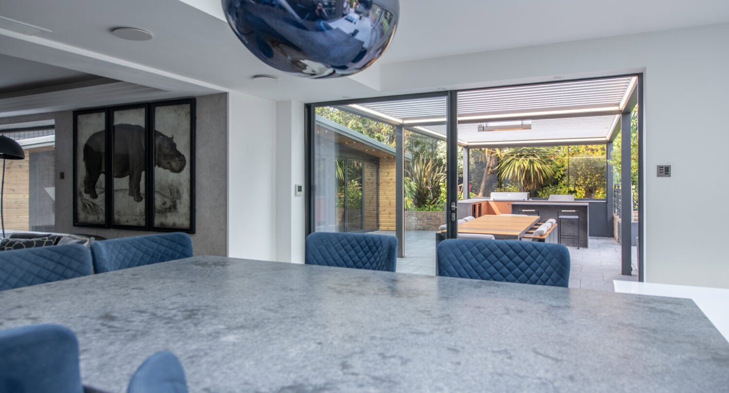 Elegant bi-folding doors opening to a stylish outdoor patio in Leadhall Lane, Harrogate. Enhance your living space with seamless indoor-outdoor access and natural light.