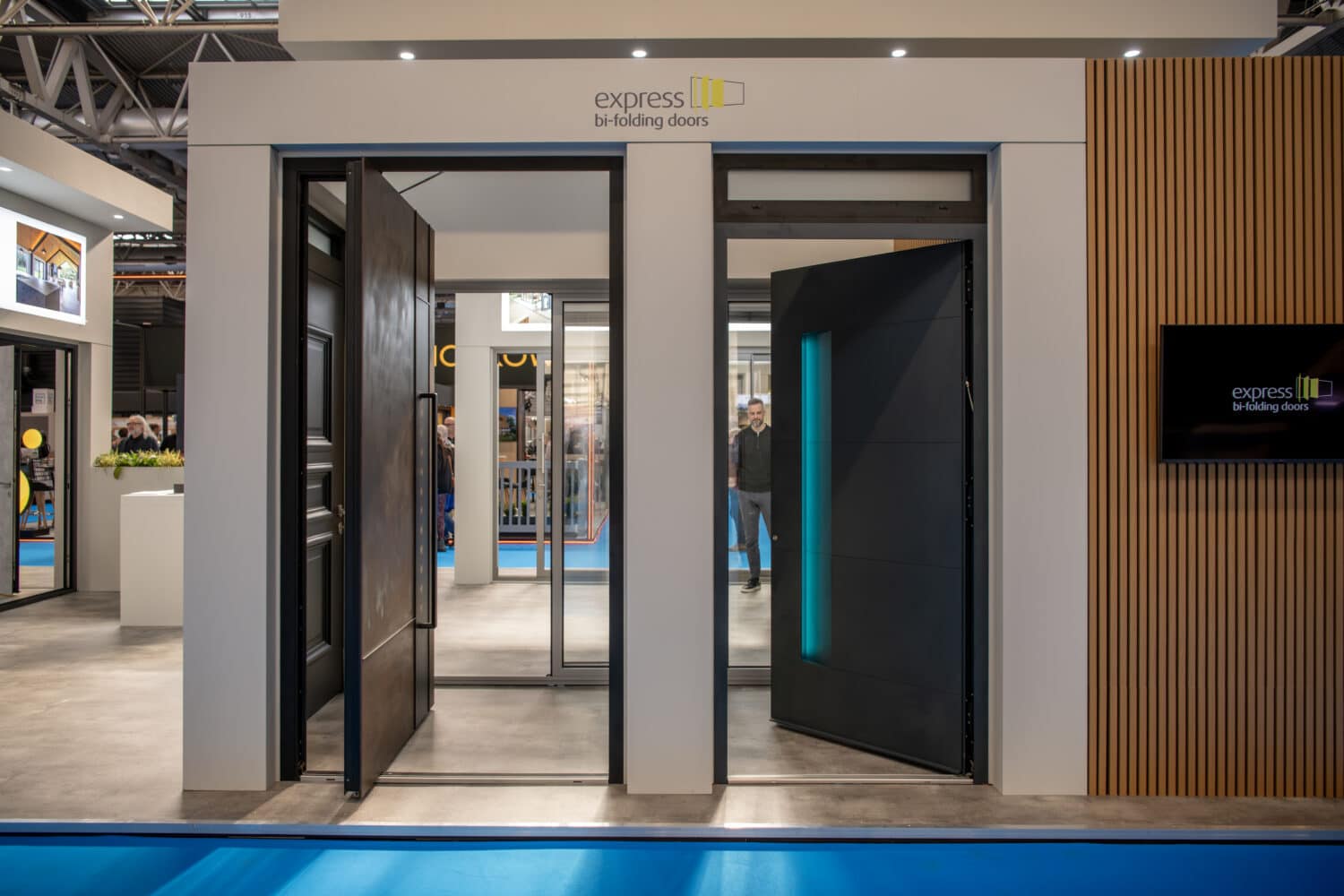 High-quality bi-folding doors showcased at the Express Bi-Folding Doors exhibition, highlighting their sleek design, durability, and space-saving features for modern living and business environments.