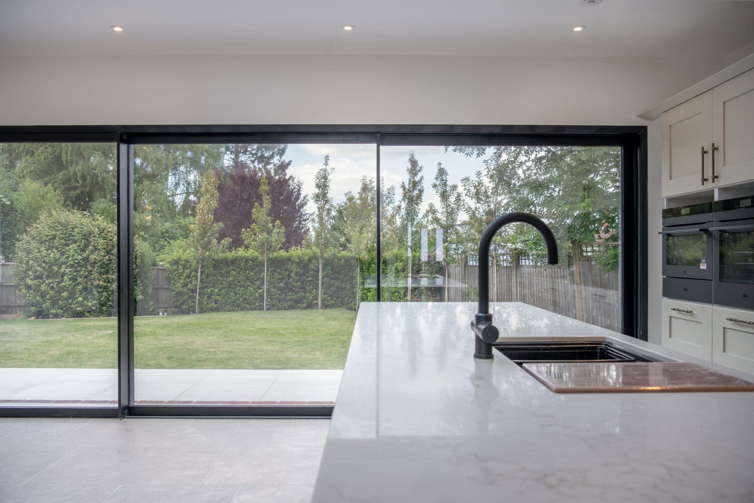 Bi-Folding Doors in Kent with Large Glass Panels for Seamless Indoor-Outdoor Living.