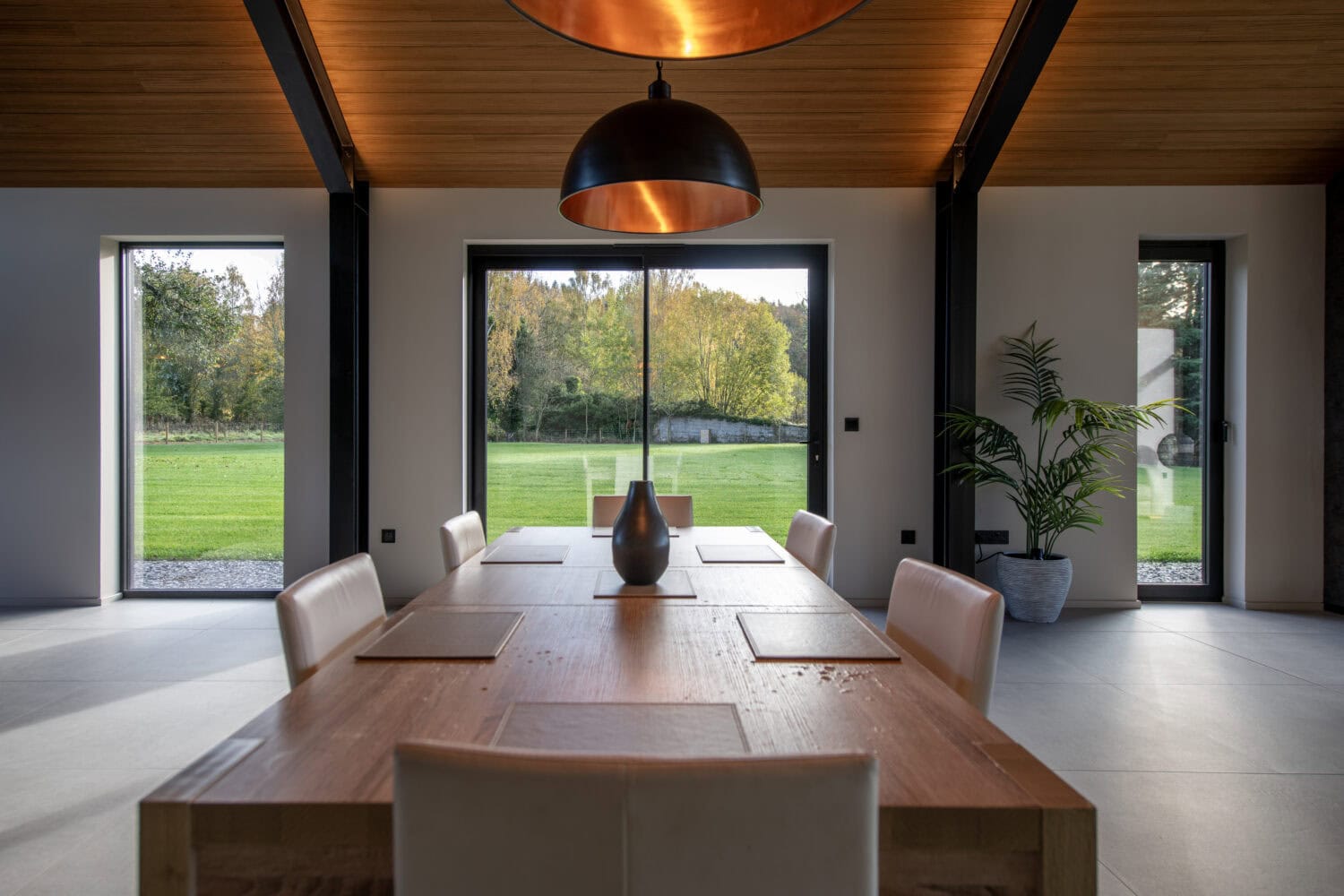 Elegant bi-fold doors at Orchard Farm, Crossford, offering seamless indoor-outdoor living and natural light.