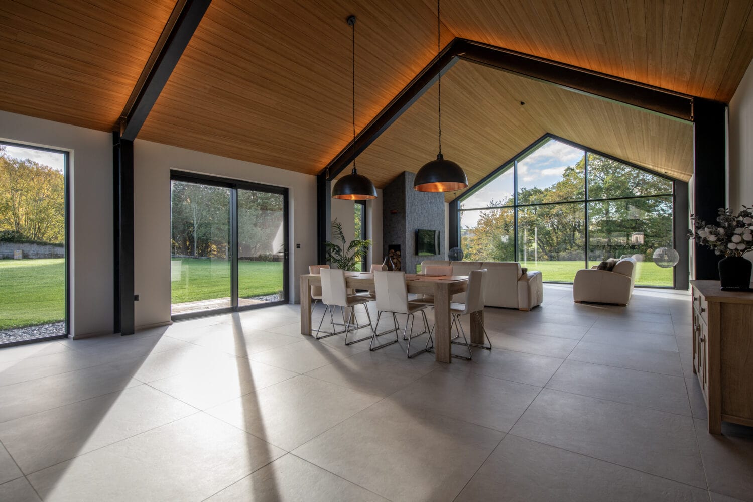 Elegant bi-folding doors from Express Bi-Folds at Orchard Farm, Crossford, offering panoramic views and easy access to outdoor spaces. Perfect for enhancing natural light and style.