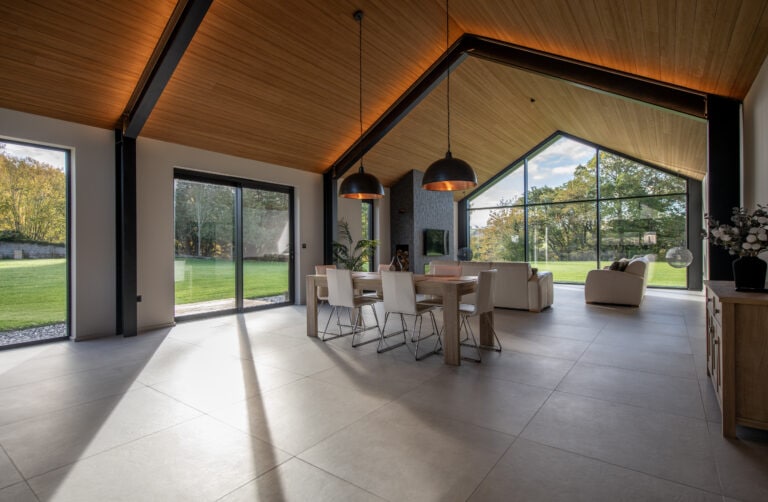 Elegant bi-folding doors from Express Bi-Folds at Orchard Farm, Crossford, offering panoramic views and easy access to outdoor spaces. Perfect for enhancing natural light and style.