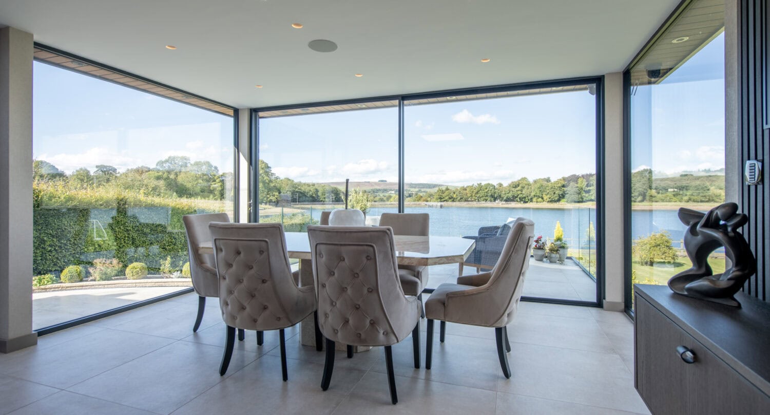 High-quality bi-folding doors opening to scenic outdoor views in Colne, Lancashire. Perfect for enhancing natural light and indoor-outdoor living spaces with stylish, durable designs.