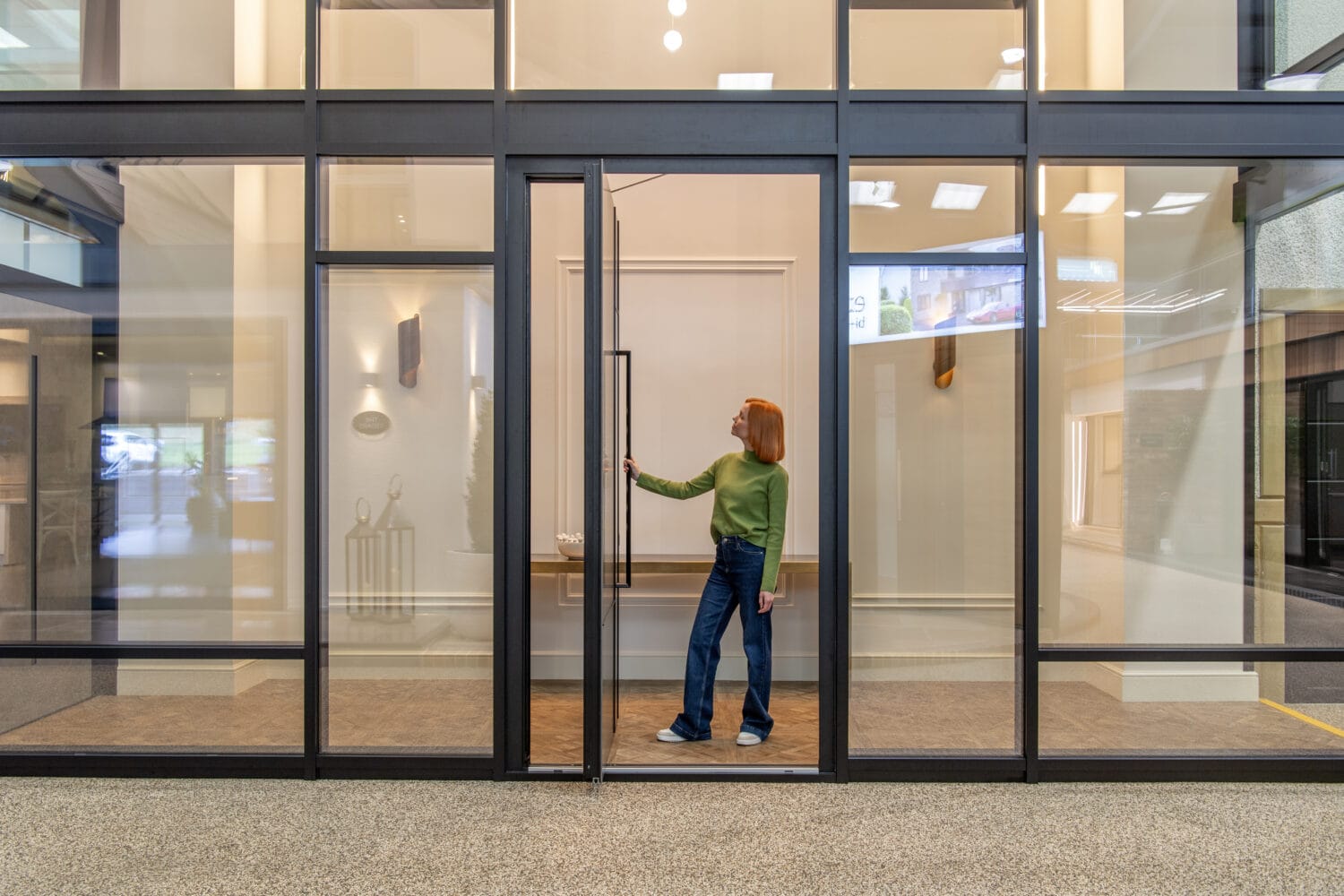Modern sliding bi-fold doors with large glass panels, ideal for enhancing natural light and space in contemporary homes and commercial spaces.