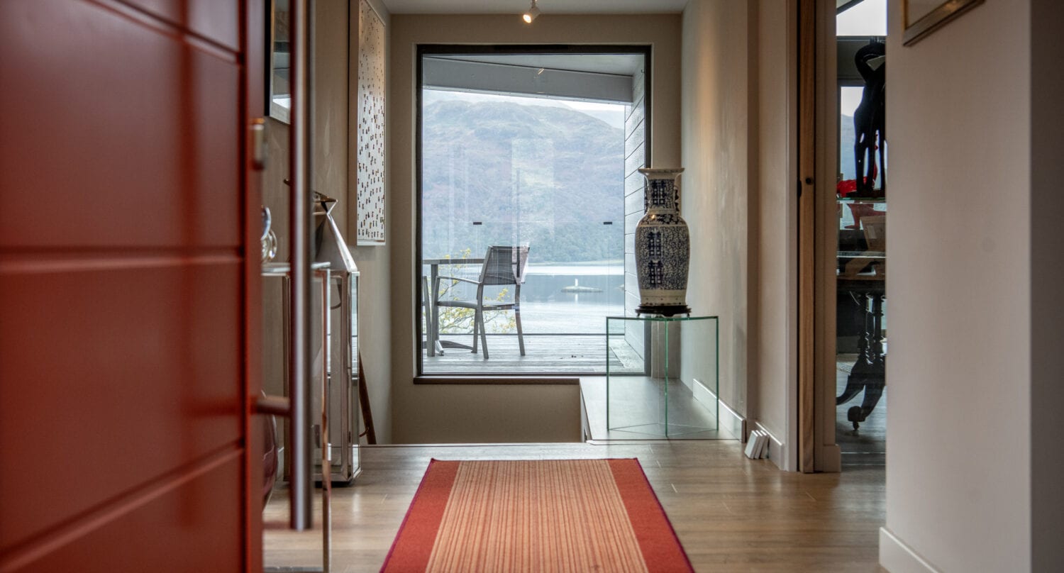 Elegant bi-folding doors opening to scenic views in Norse Lodge, Helensburgh. Perfect for seamless indoor-outdoor living and enhancing natural light.