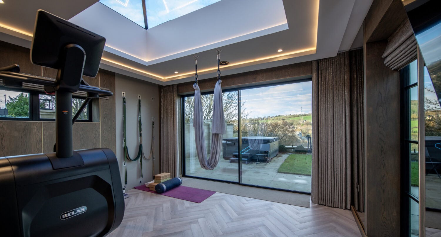 High-quality XP Glide bi-fold doors providing seamless indoor-outdoor living with large glass panels and smooth operation.