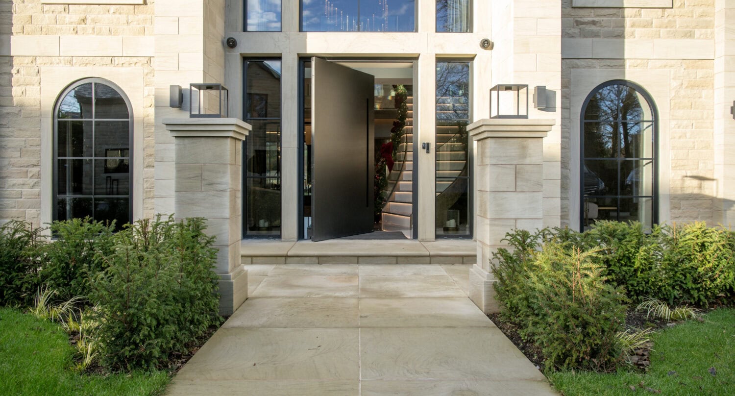 Elegant pivot doors with sleek black finish, enhancing the contemporary look of the building's entrance. Perfect for stylish homes and commercial properties.