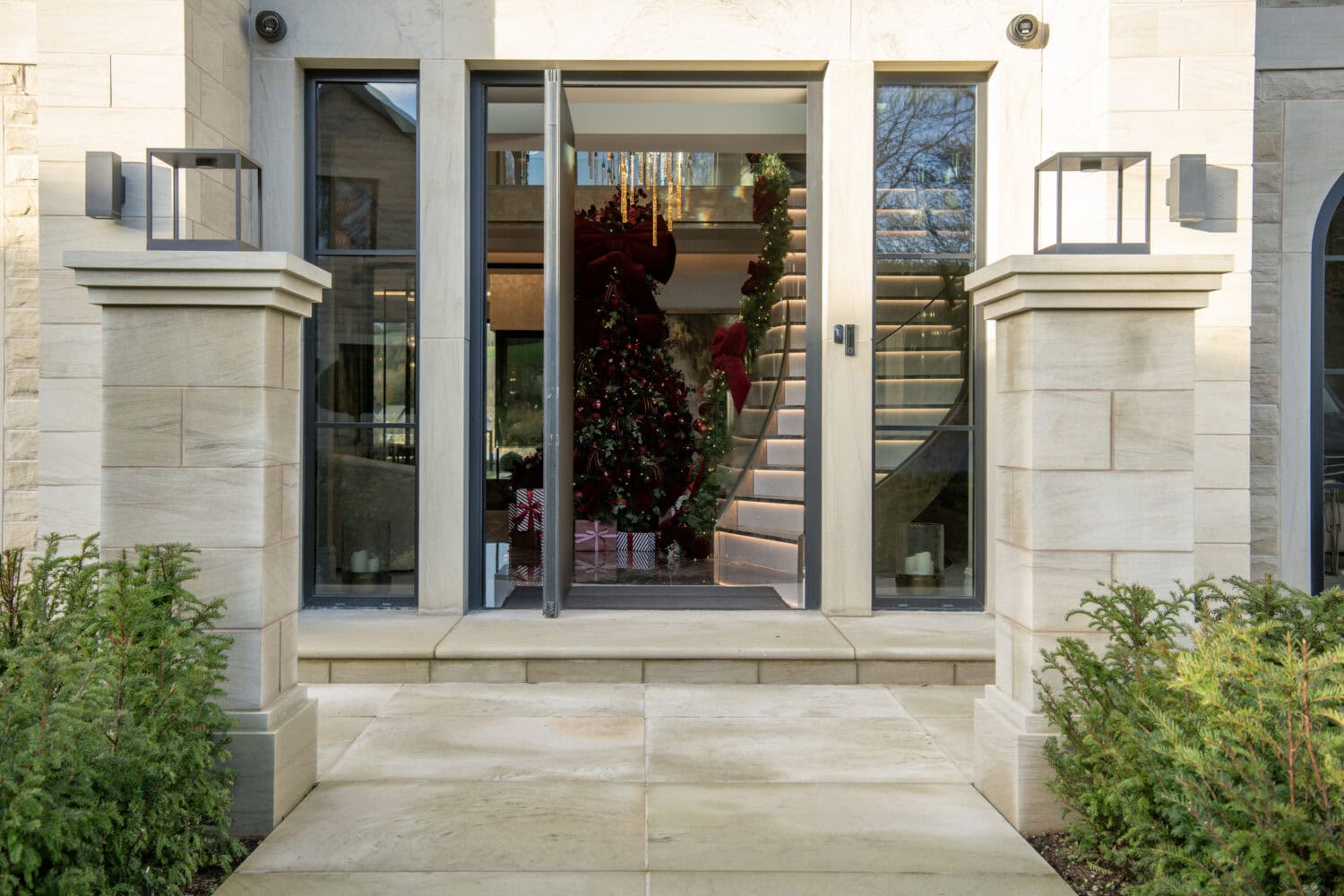Elegant bi-folding doors with large glass panels, perfect for seamless indoor-outdoor living and enhancing natural light in your home.