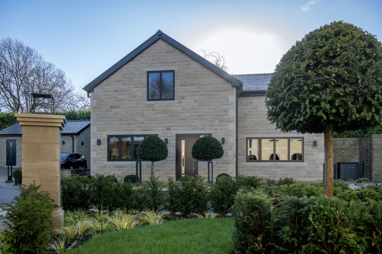 Steel look bifold doors providing sleek, contemporary style and seamless indoor-outdoor living. Perfect for enhancing the aesthetic of modern homes with durable, stylish aluminium frames.