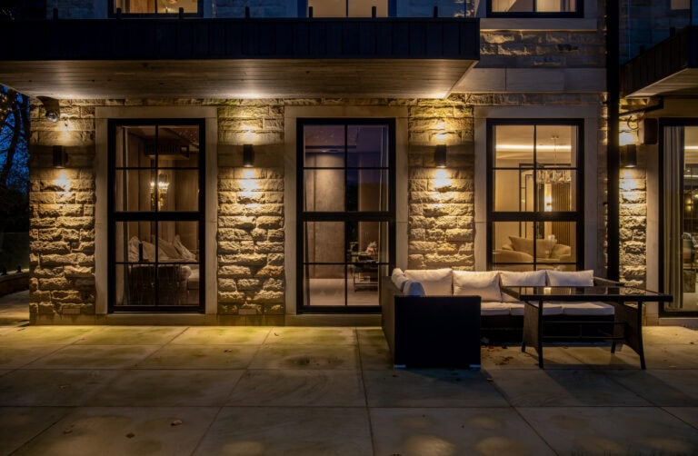 Elegant steel-look bi-fold doors enhancing contemporary living spaces and outdoor views. Perfect for stylish, durable, and secure home renovations.