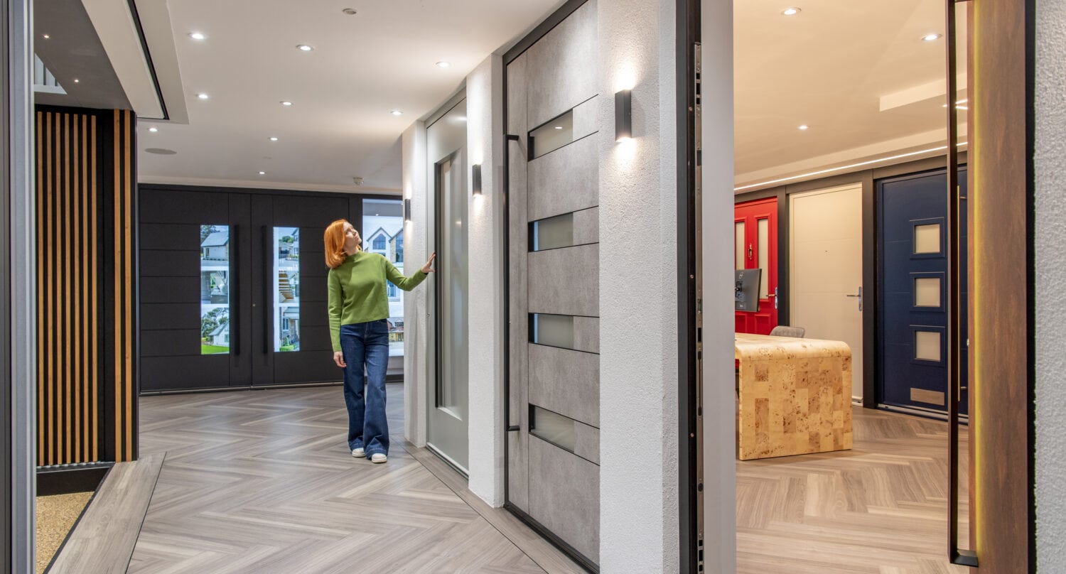 Modern bi-folding doors display at the new Milton Keynes showroom opening March 16th, showcasing stylish and functional solutions for contemporary home interiors.