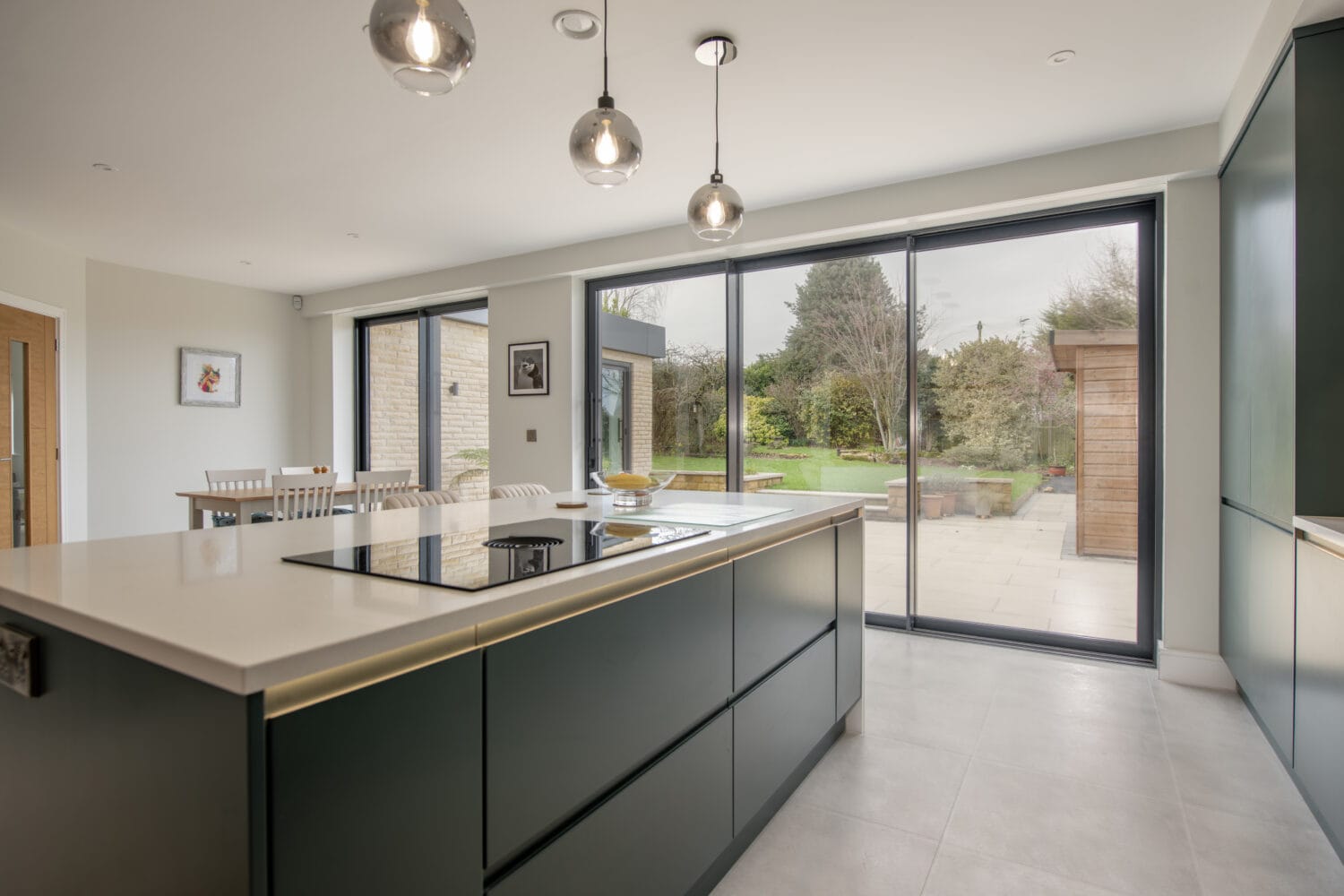 Elegant bi-folding doors opening to a garden in Chapel Grove home.