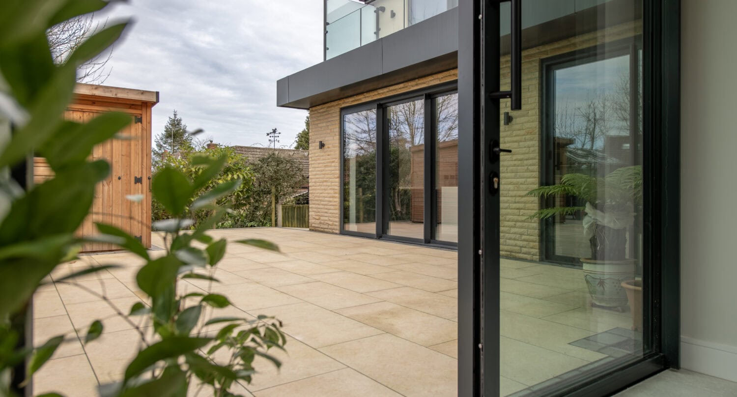 Elegant bi-folding doors opening to outdoor patio at Chapel Grove.