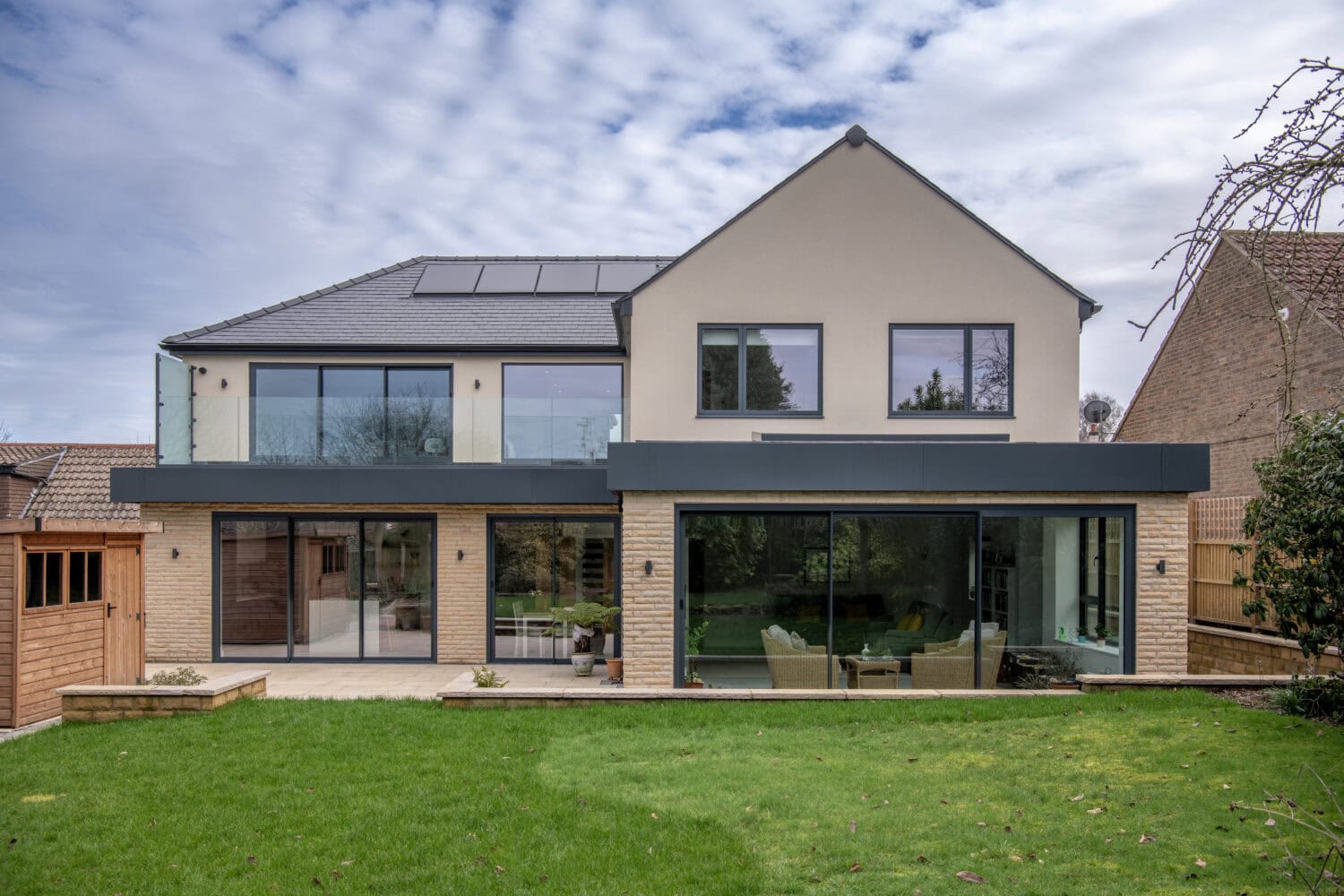 Elegant bi-folding doors from Express Bi-Folds at Chapel Grove, enhancing natural light and outdoor views. Perfect for contemporary homes seeking stylish, functional access solutions.