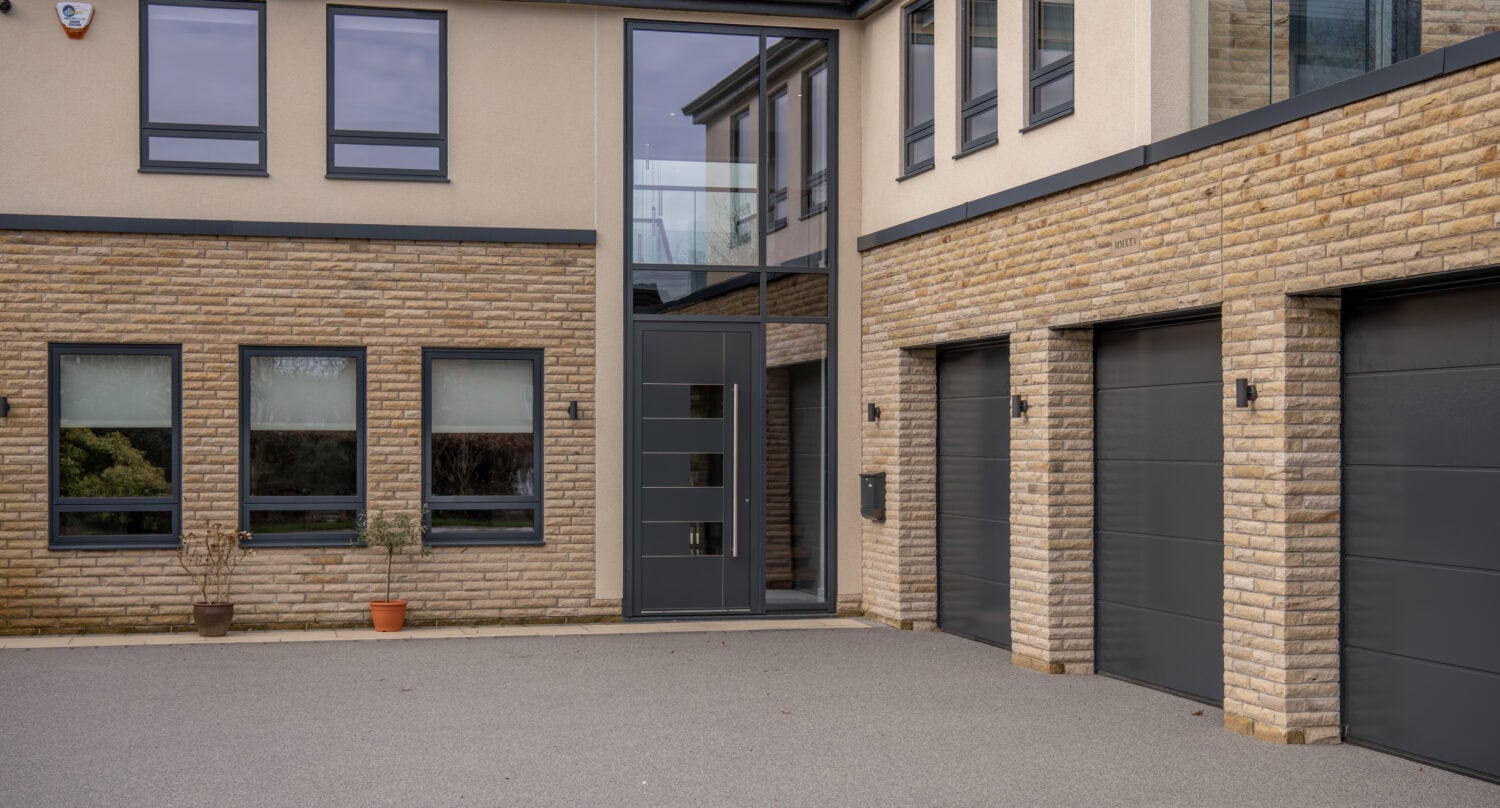 Contemporary bi-folding doors at Chapel Grove property, enhancing natural light and outdoor views with sleek design and high-quality materials.