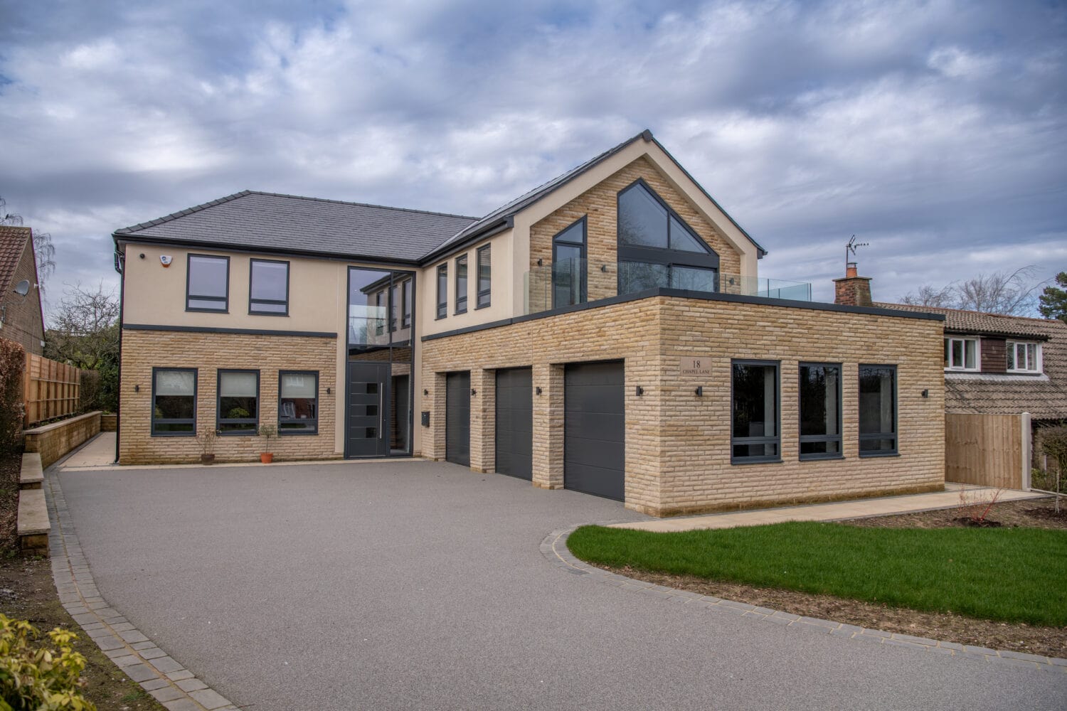 Contemporary residential property featuring large bi-folding doors at Chapel Grove, enhancing natural light and outdoor views. Perfect for modern homes seeking stylish, functional glazing solutions.
