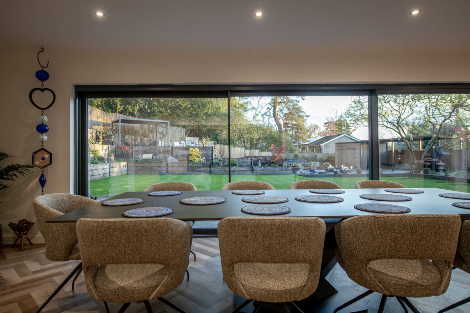 Bi-Fold doors opening to garden, ideal for kitchen dining spaces. Enhance your home with stylish, functional sliding doors that bring natural light and outdoor views indoors.