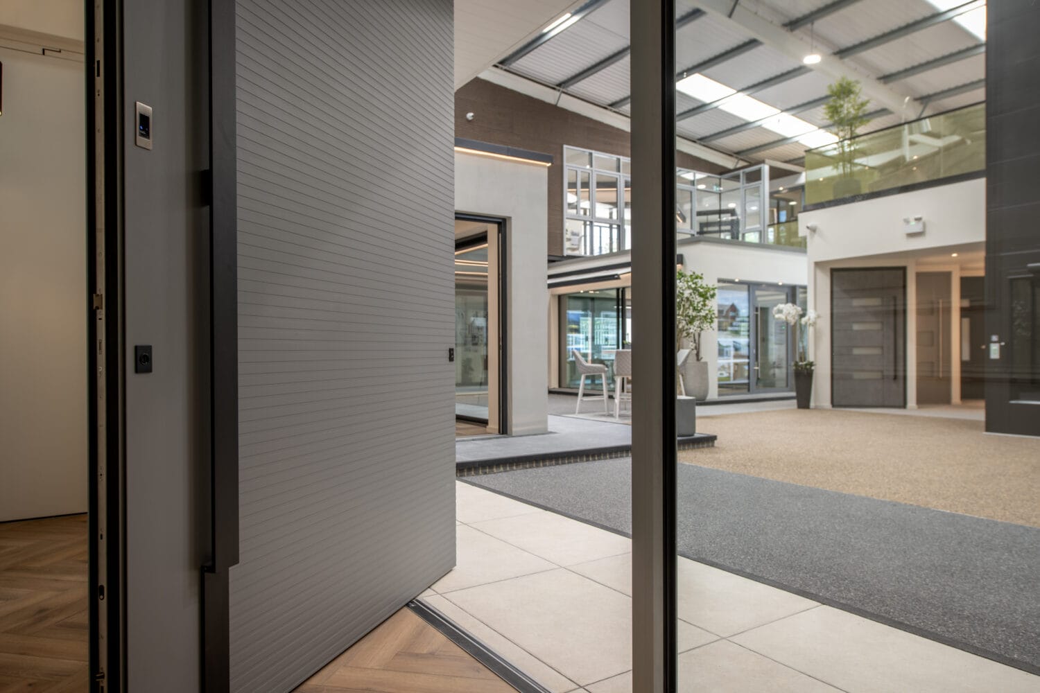 Modern Milton Keynes showroom featuring large bi-folding doors opening to a spacious interior with natural light and contemporary design.