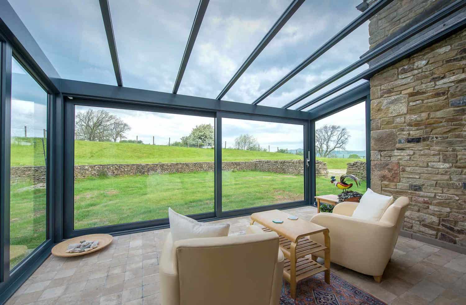Aluminium lean to roof used to create a bright and airy conservatory in the country.