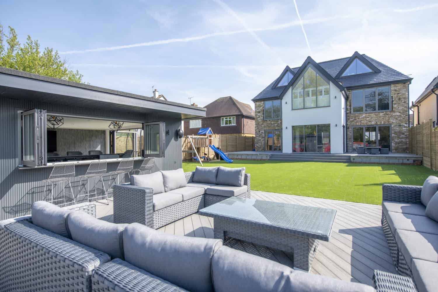 Stunning garden social space complete with bar and bifold casement windows