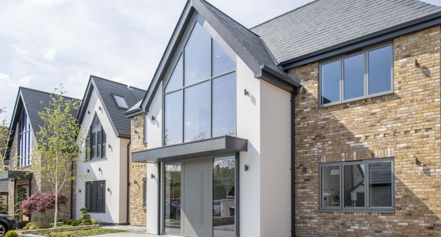 New build houses featuring grey windows and front doors
