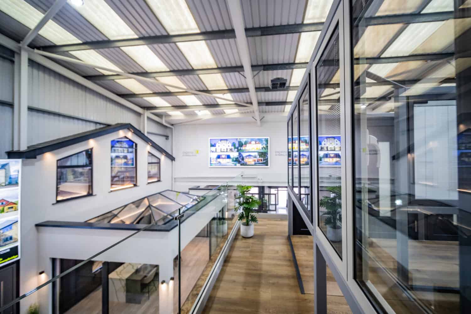 Glass balustrade balcony with a view to a modern home extension in showroom