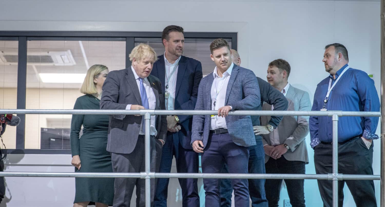 Boris Johnson and Express Bifolds team having a conversation in the showroom