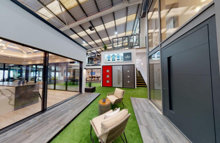 Modern entrance doors, wide aluminium sliding doors and more in a showroom