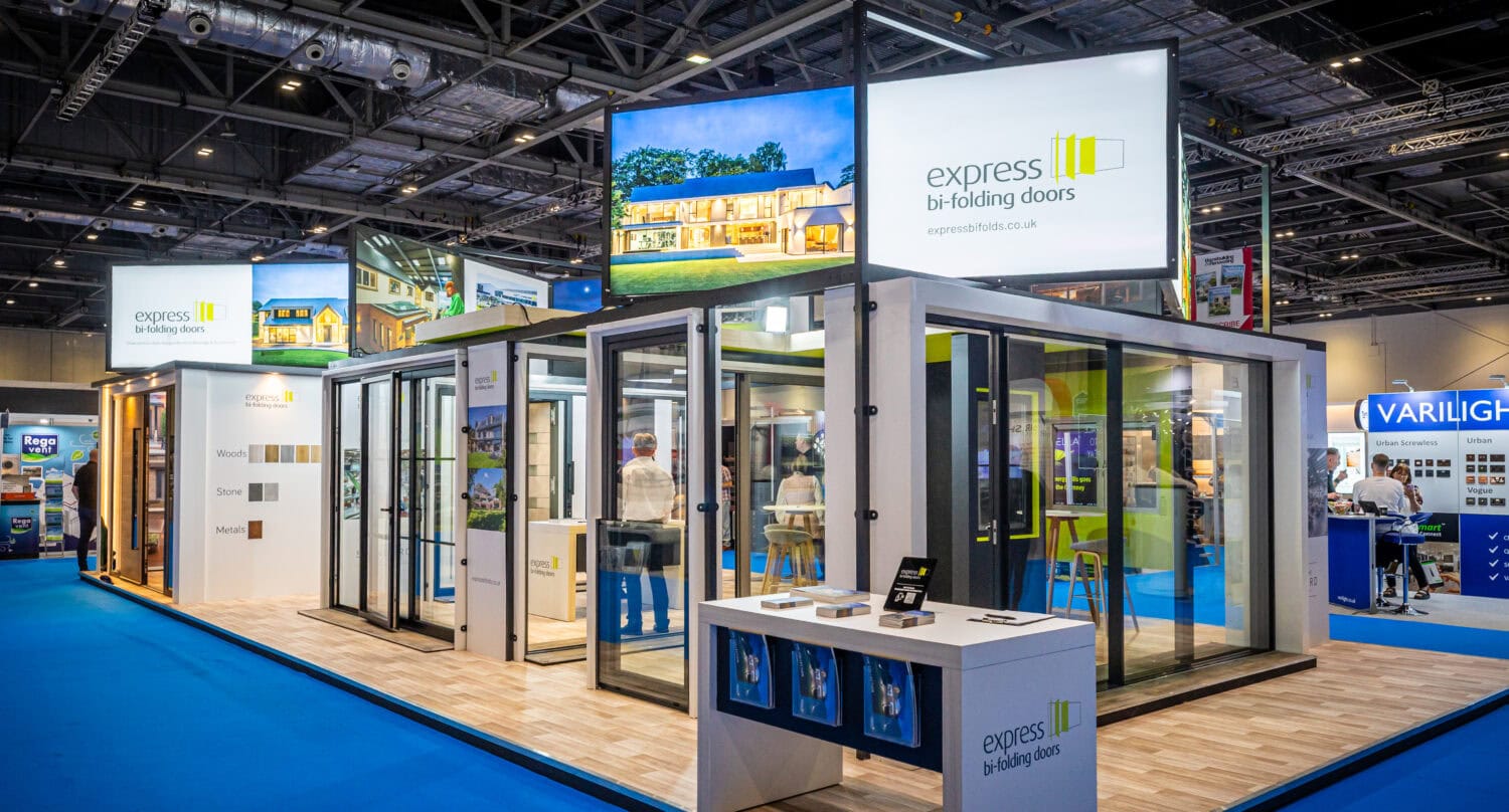 Modern exhibition stand showcasing high-quality bi-folding doors at a trade event, highlighting innovative designs and durable materials for stylish home and commercial use.