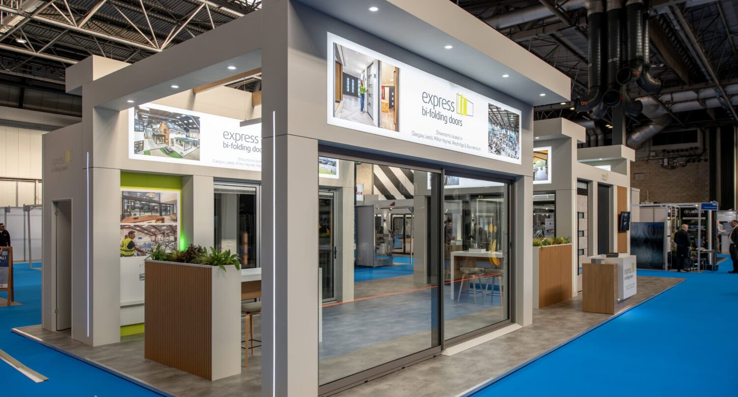 Modern display of Express Bi-Folding Doors at an exhibition, showcasing their sleek design and high-quality craftsmanship for upcoming events and exhibitions.