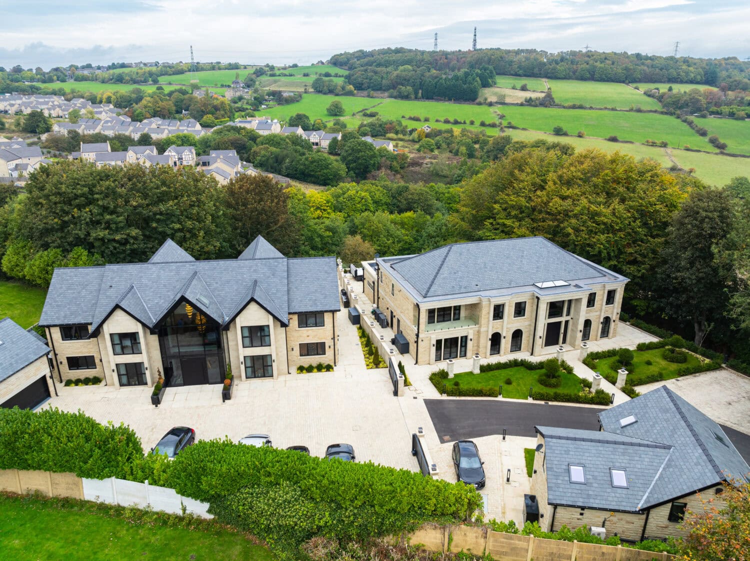 Elegant bi-folding doors enhance the modern design of the Arlington luxury development, offering seamless indoor-outdoor living and panoramic views of the surrounding countryside.