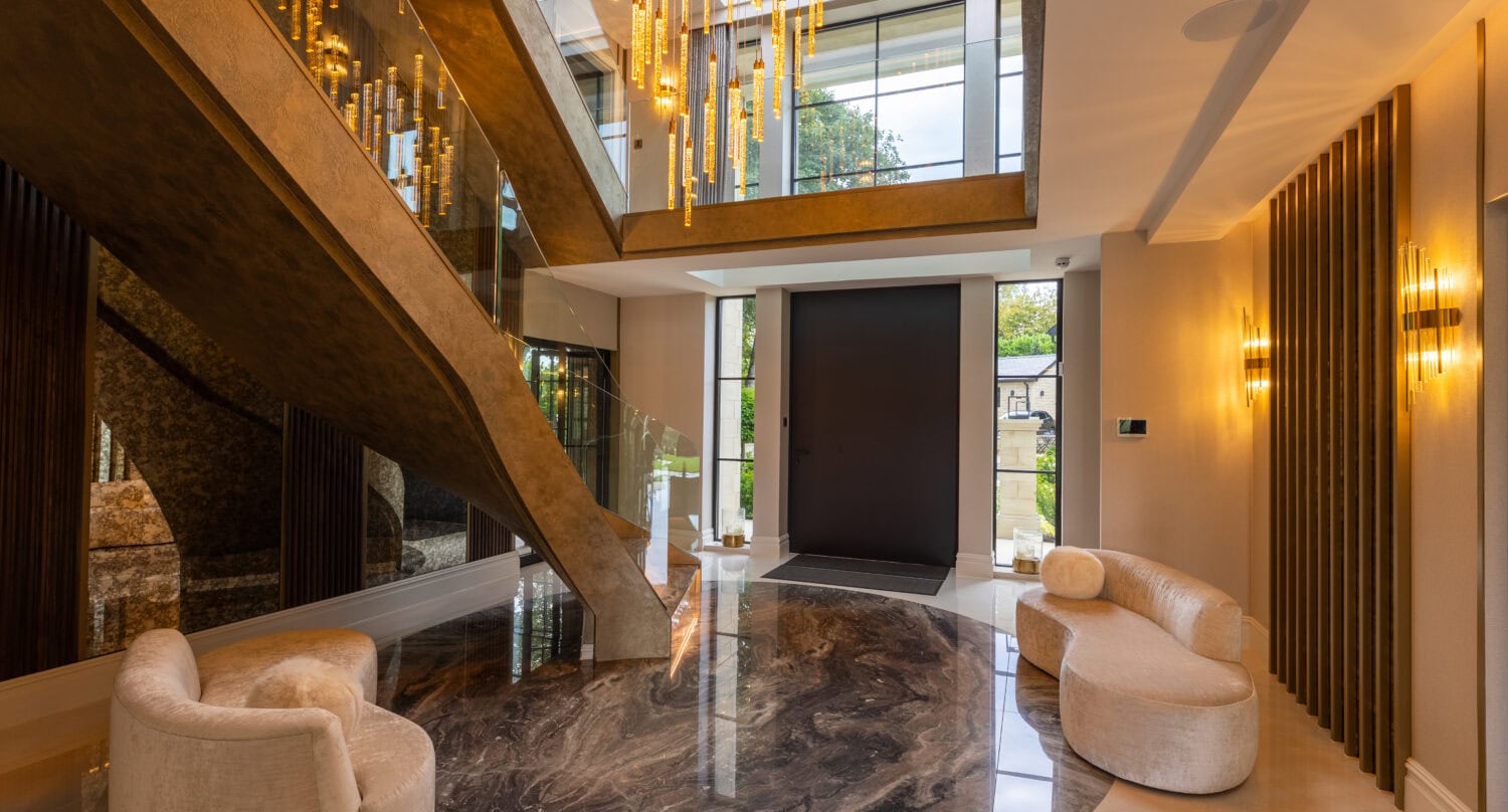 Elegant bi-folding doors opening to a modern entrance hall.