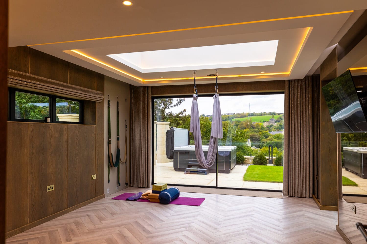 High-quality bi-folding doors opening to outdoor space in Arlington luxury development. Perfect for seamless indoor-outdoor living and enhancing modern home aesthetics.