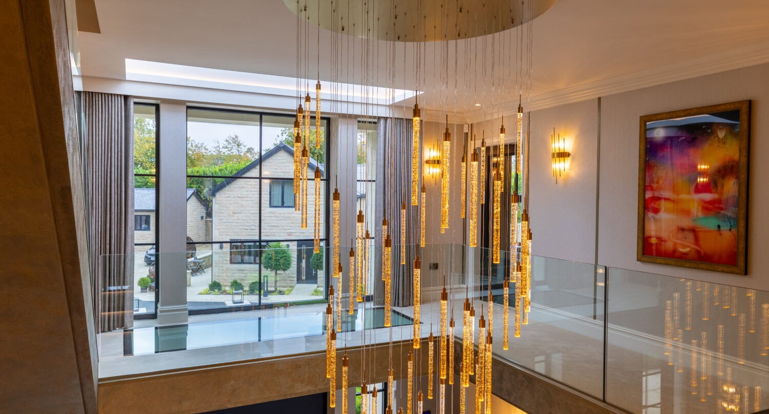 Elegant bi-folding doors opening to a modern living space in Arlington luxury development. Perfect for seamless indoor-outdoor living and enhancing natural light.