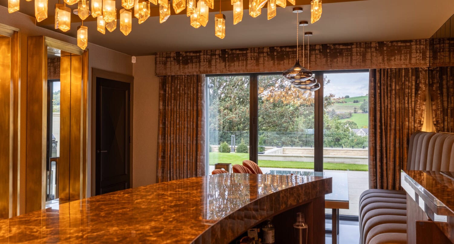 Elegant bi-folding doors opening to scenic outdoor views.