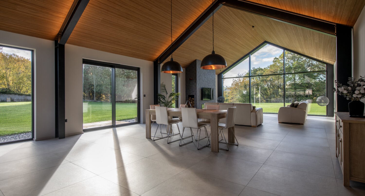 Elegant bi-folding doors from Express Bi-Folds at Orchard Farm, Crossford, offering panoramic views and easy access to outdoor spaces. Perfect for enhancing natural light and style.