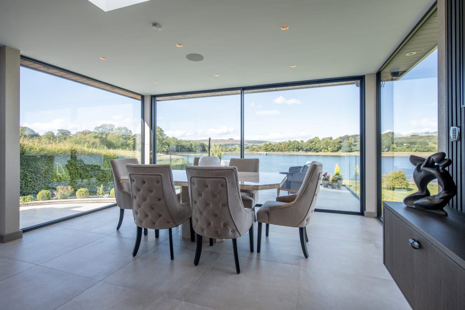 High-quality bi-folding doors opening to scenic outdoor views in Colne, Lancashire. Perfect for enhancing natural light and indoor-outdoor living spaces with stylish, durable designs.