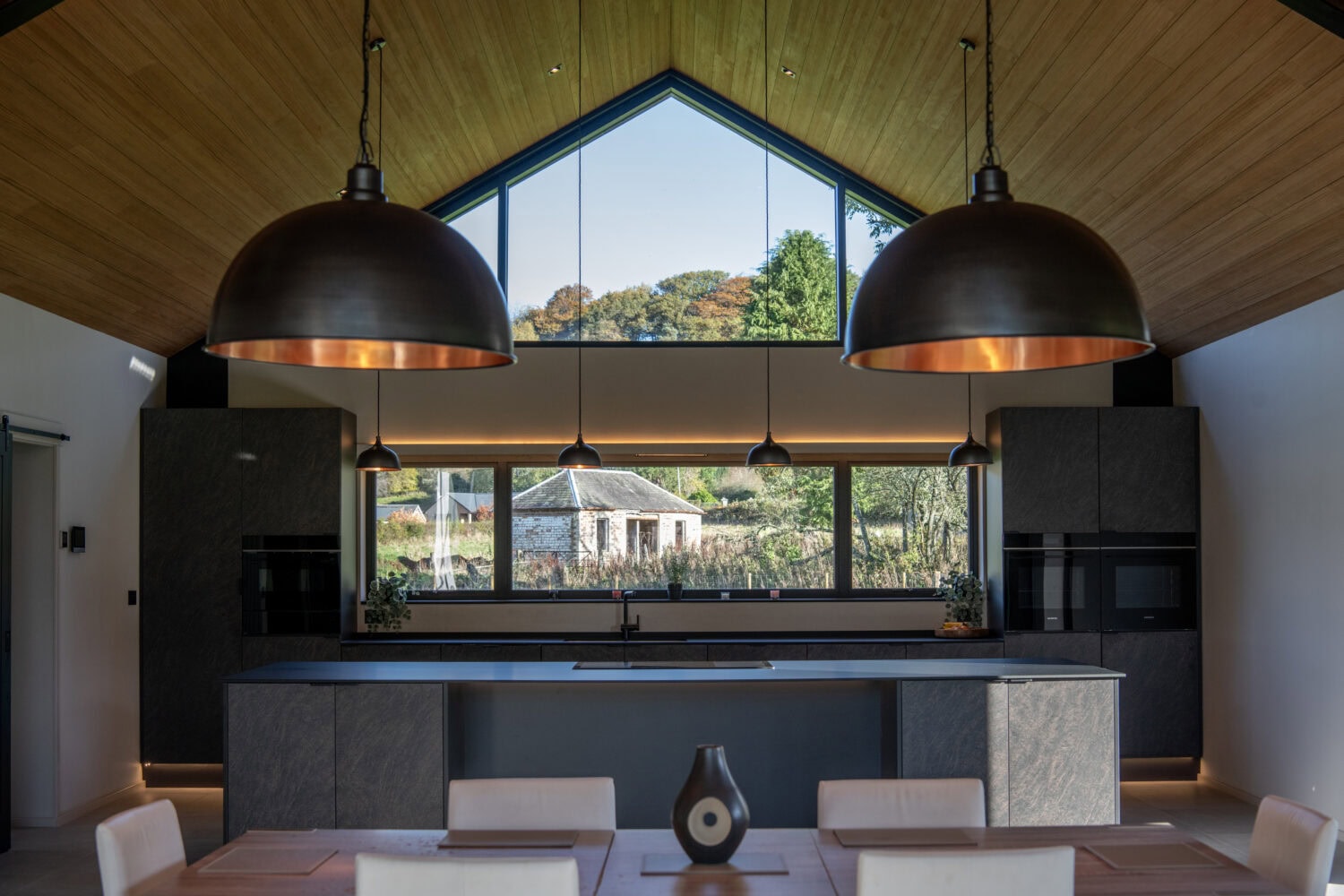 Elegant bi-folding doors at Orchard Farm, Crossford, offering seamless indoor-outdoor living with natural light and panoramic views. Perfect for contemporary homes.