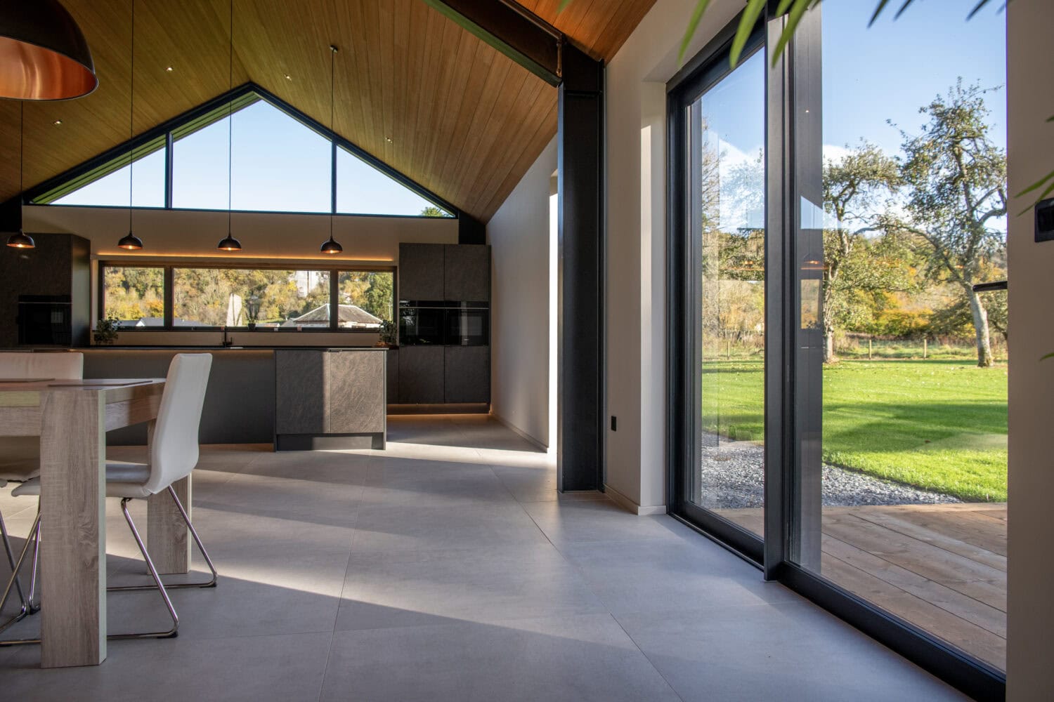 High-quality bi-folding doors from Express Bi-Folds at Orchard Farm, Crossford, offering stylish, durable, and space-saving solutions to enhance natural light and outdoor views.