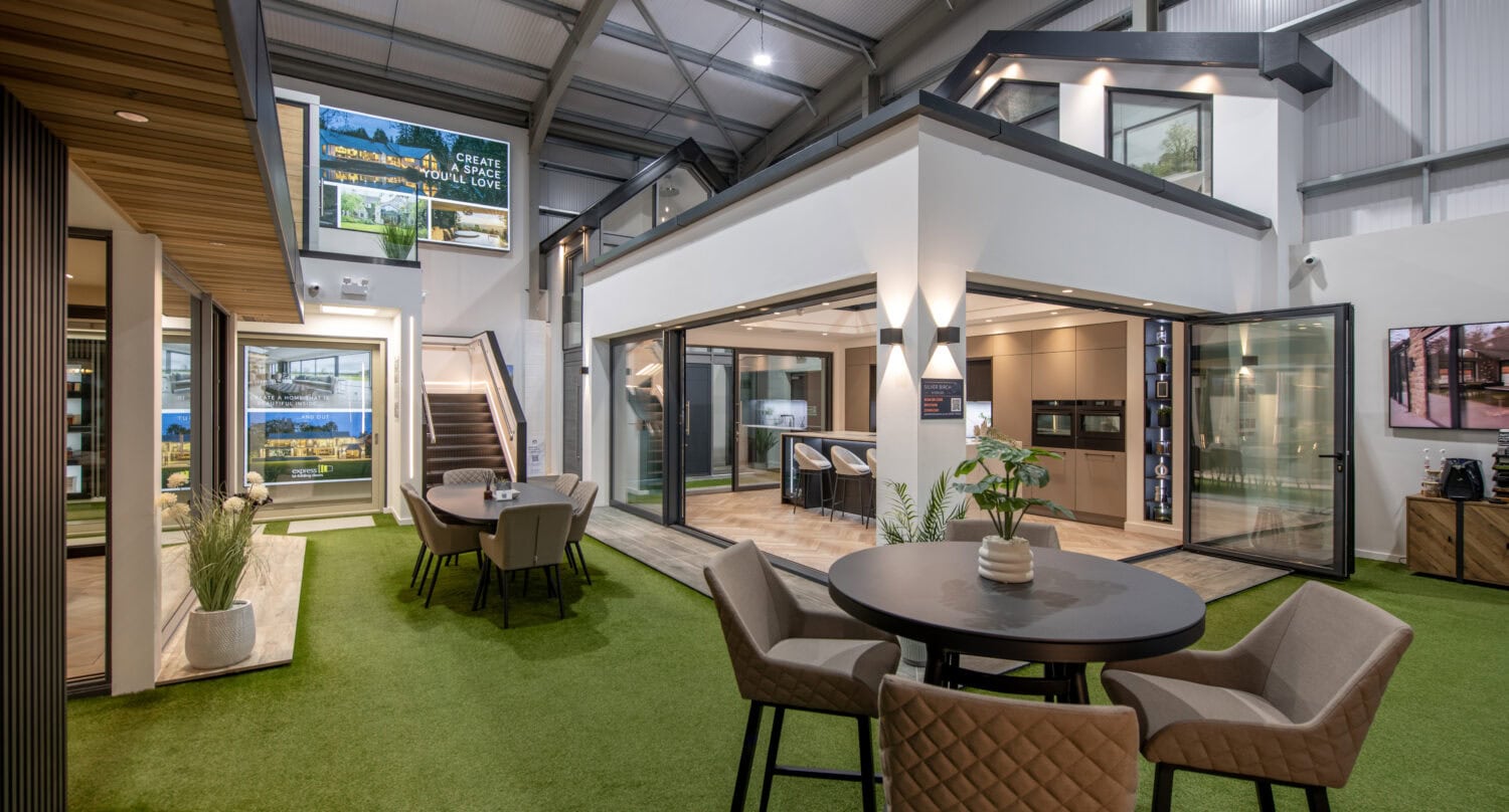 Elegant bi-folding doors showcased in a modern Glasgow showroom, highlighting seamless indoor-outdoor living solutions and stylish design options.
