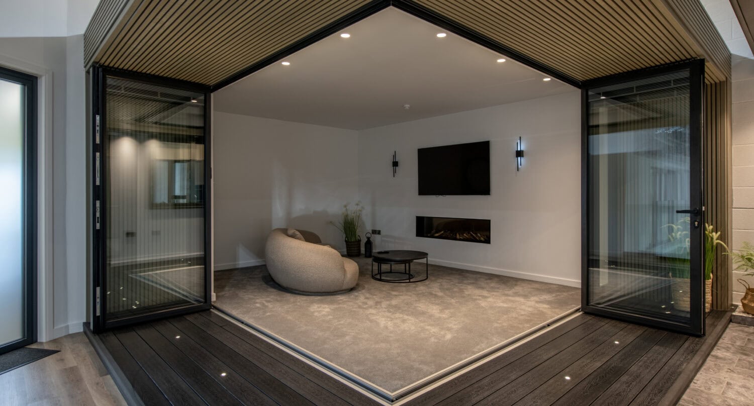 Elegant bi-folding doors opening to a modern indoor living space.