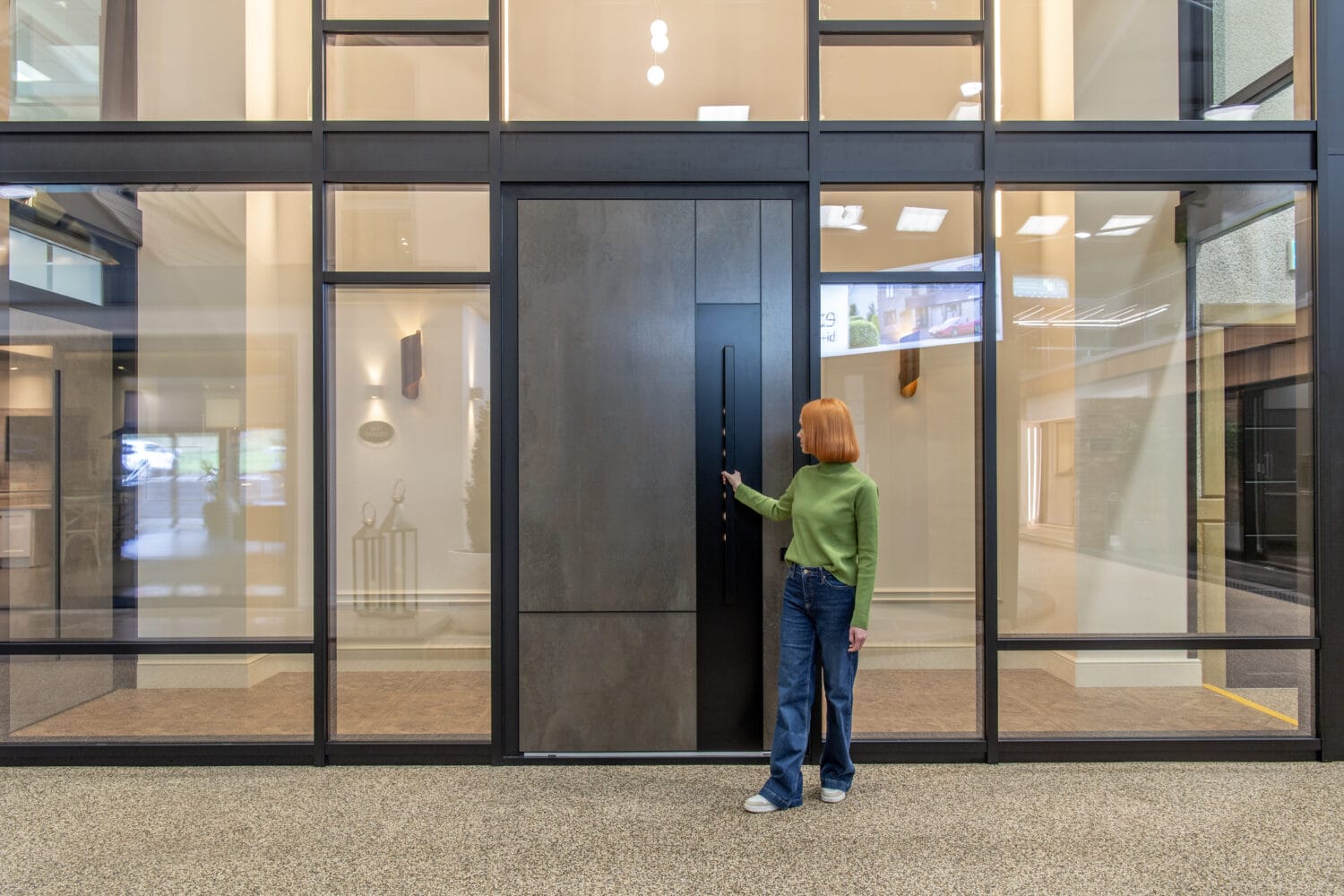 Modern sliding bi-fold doors with large glass panels, ideal for seamless indoor-outdoor living and enhancing natural light in contemporary homes.