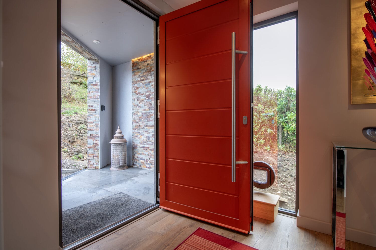 High-quality bi-folding doors installed at Norse Lodge, Helensburgh, showcasing seamless indoor-outdoor transition and contemporary design.