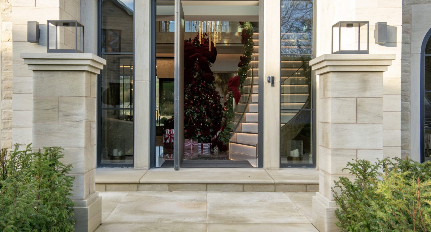 Elegant bi-folding doors with large glass panels, perfect for seamless indoor-outdoor living and enhancing natural light in your home.