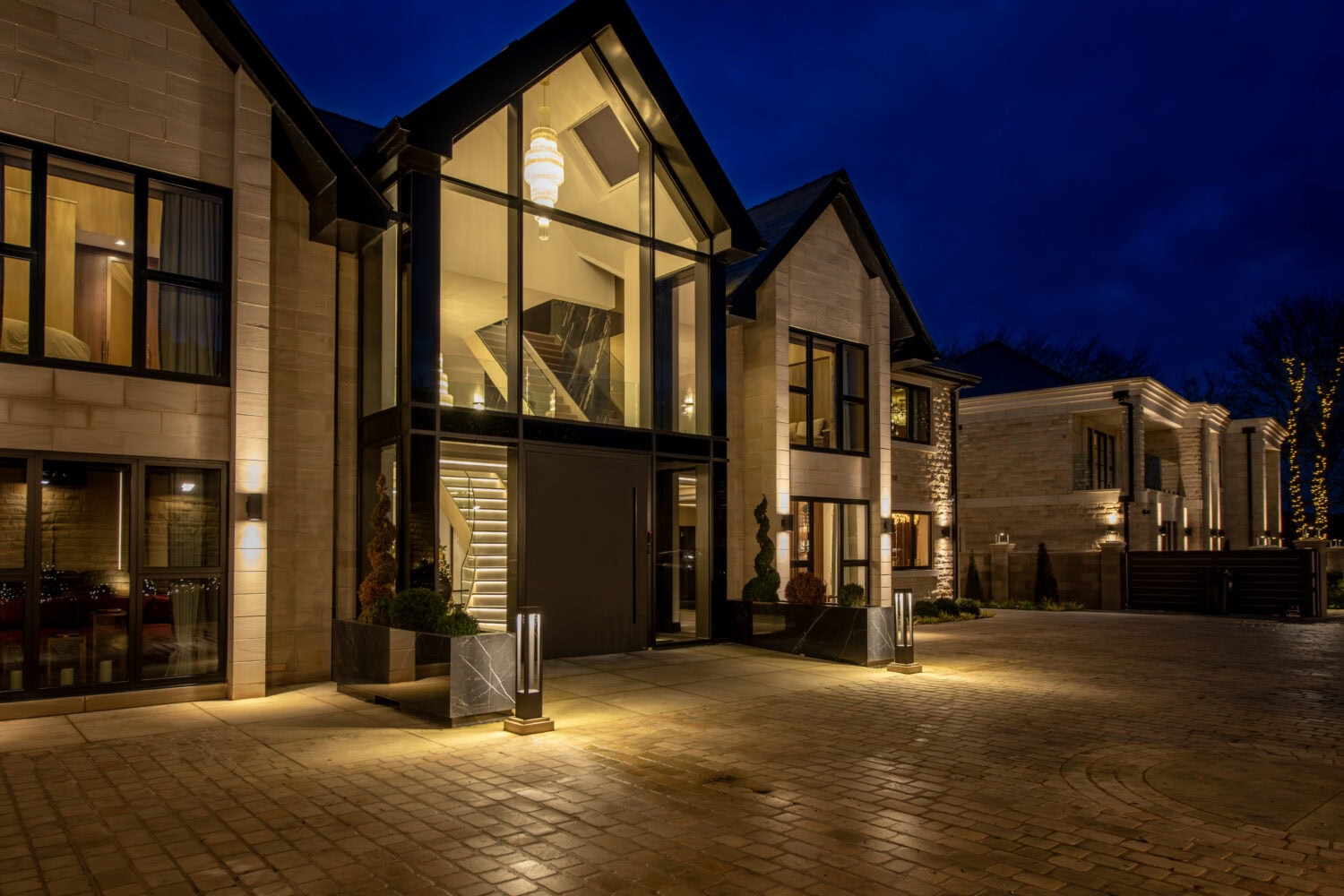 Stylish pivot doors with large glass panels enhancing home aesthetics and natural light. Perfect for contemporary properties seeking a sleek, modern entrance solution.